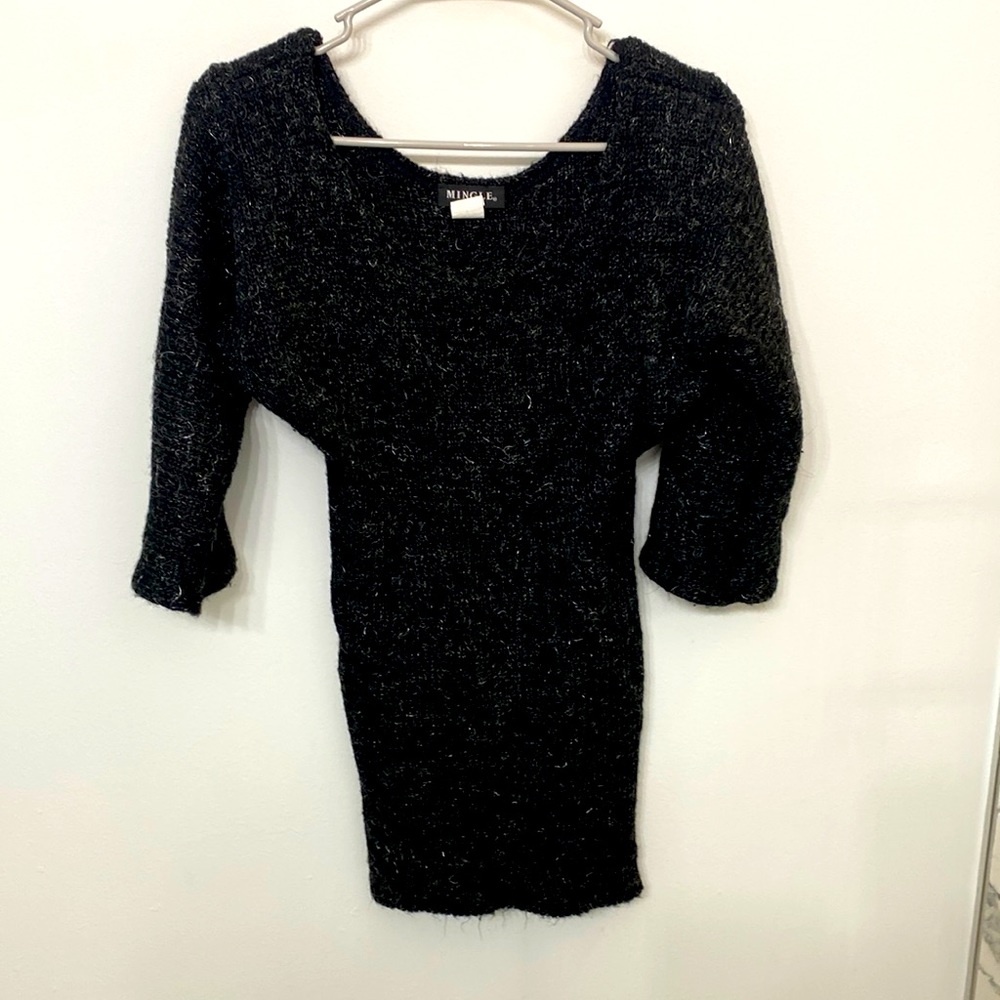 Black rib fitted sweater. With 3/4 bell sleeves. Shimmery stitching